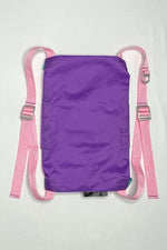 Back image of the purple Rider Pack which features purple ripstop fabric with pink straps. Strap adjusters and a d-ring are included. 