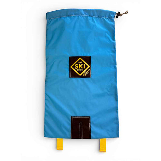 A bright blue ski boot cover with a black and yellow 'The Ski Club' logo patch in the center and two yellow hanging straps at the bottom, shown on a plain white background.