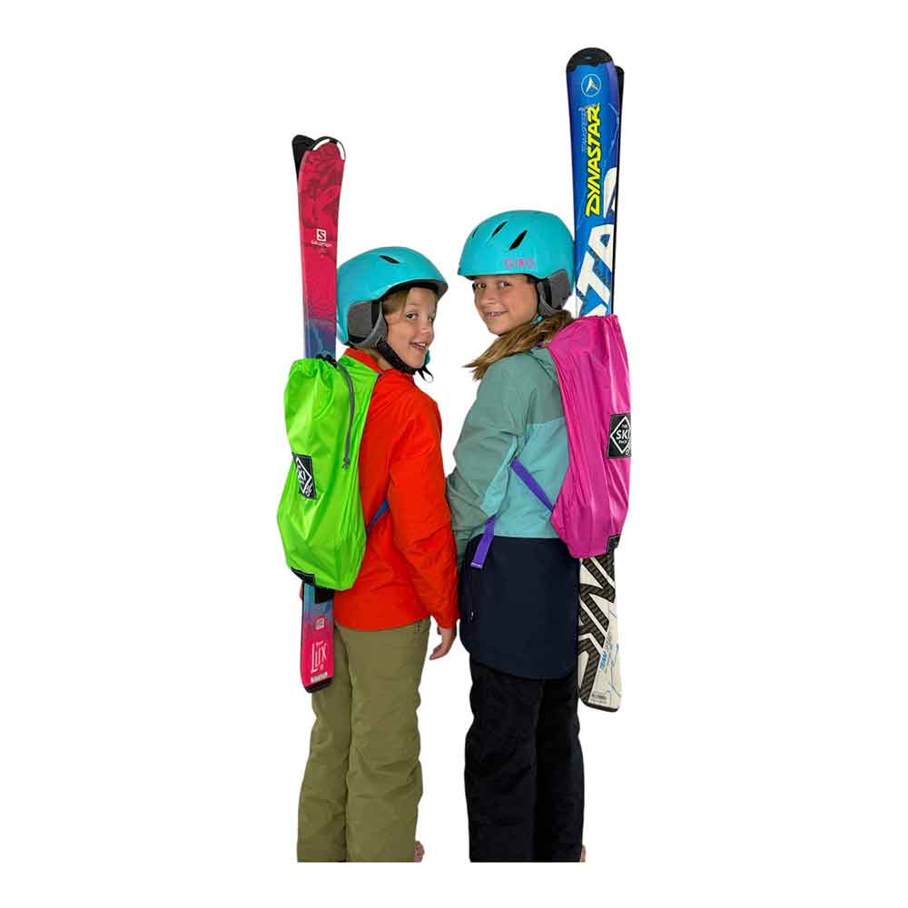 Two children with skis and Pure Mountain Fun backpacks on a white background