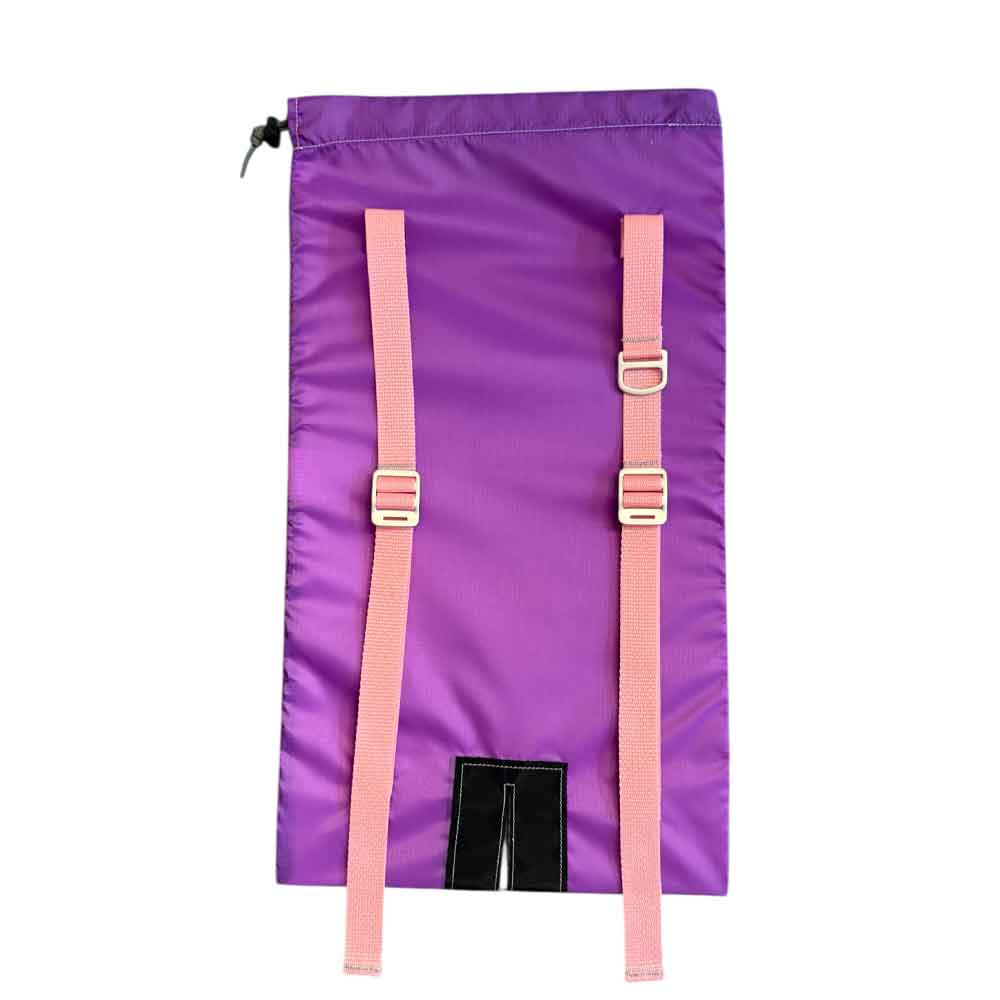A purple drawstring Ski backpack shown flat against a white background, featuring two adjustable pink webbing straps with silver metal buckles and a black plastic hook-and-loop closure at the bottom.