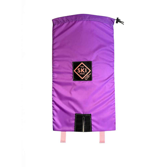 A purple ski Pack by Pure Mountain Fun, featuring a black brand patch on the front, a drawstring closure at the top, and a black hook-and-loop closure panel at the bottom with pink adjustment straps.