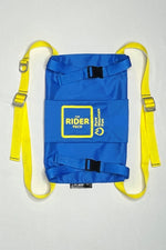 Front image of the blue Rider Pack featuring yellow straps with adjusters. Blue straps go across the snowboard to hold it secure. 