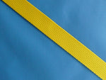Close up image of Blue youth ski pack  fabric and yellow strap