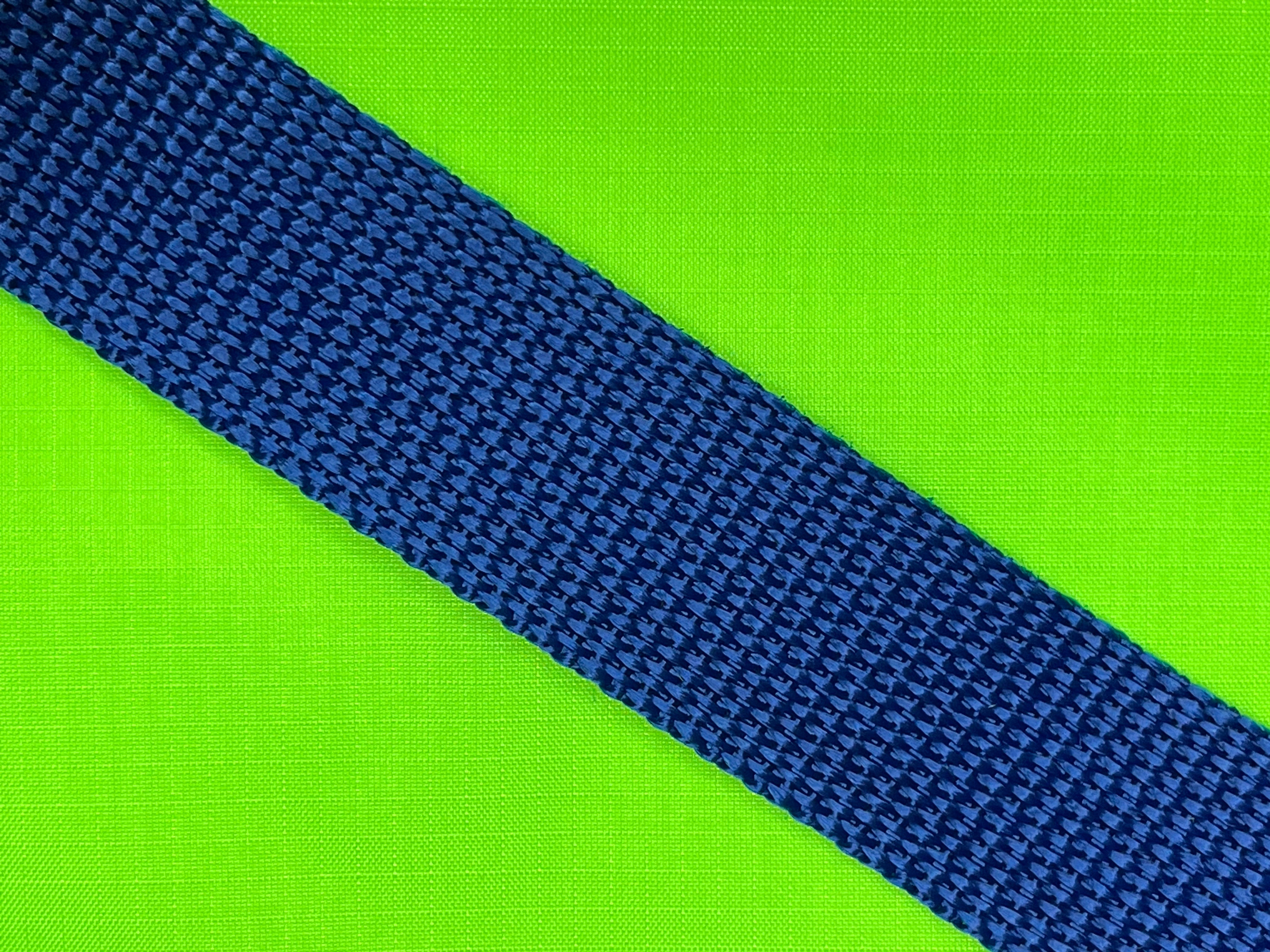 Close up of green fabric with blue straps