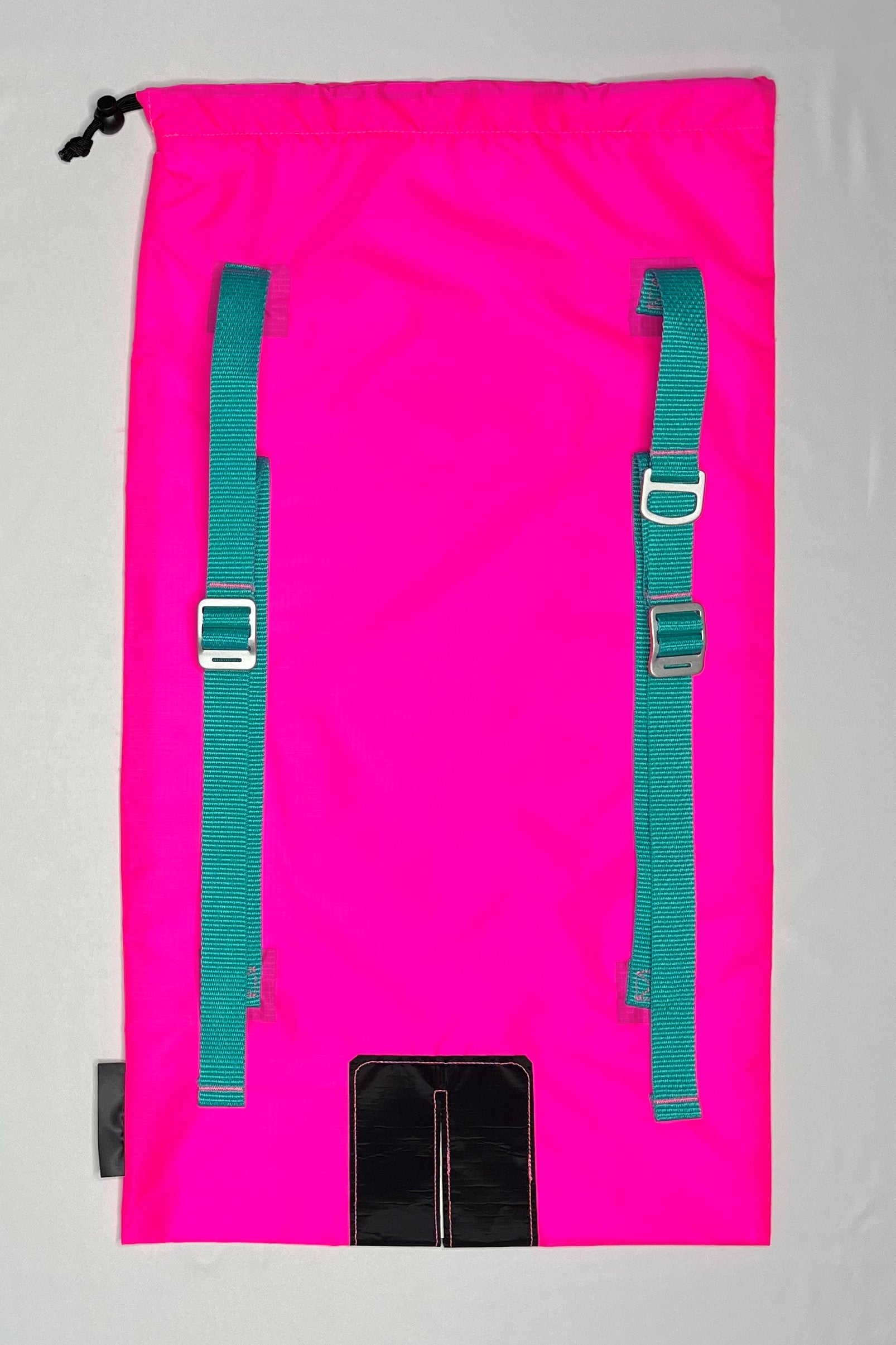 Back image of neon Pink Ski pack with Teal straps, and aluminum strap adjusters and d-ring.