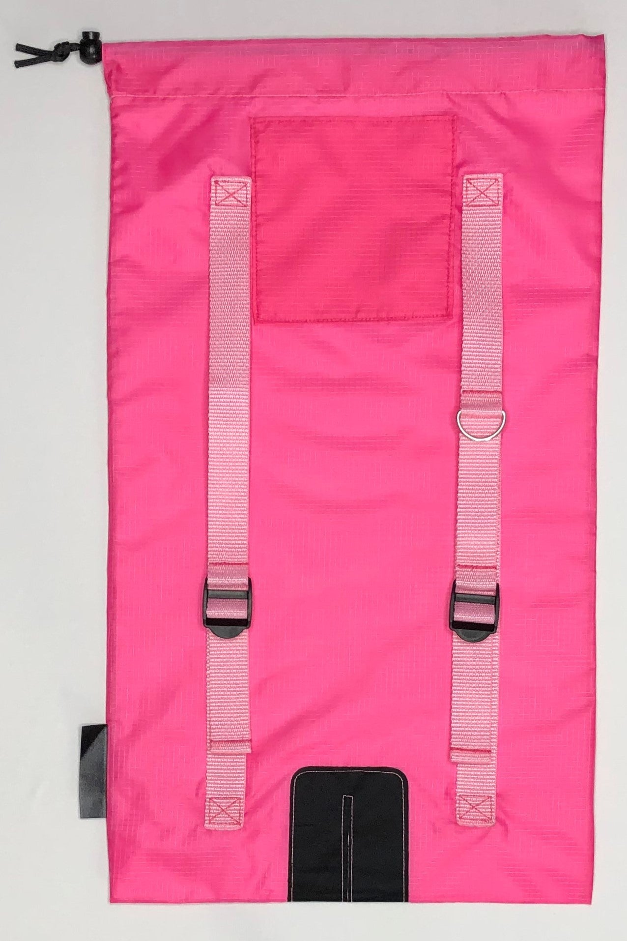 Image of pink Ski Pack fabric with light pink straps.  Features adjuster straps and d-ring for carrying ski accessories
