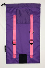 Image of purple Ski Pack fabric with light pink straps.  Features adjuster straps and d-ring for carrying ski accessories