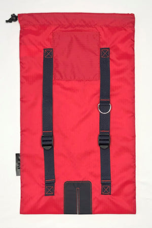 Image of red bag with dark navy straps and dark navy logo.   Features adjuster straps and d-ring for carrying ski accessories